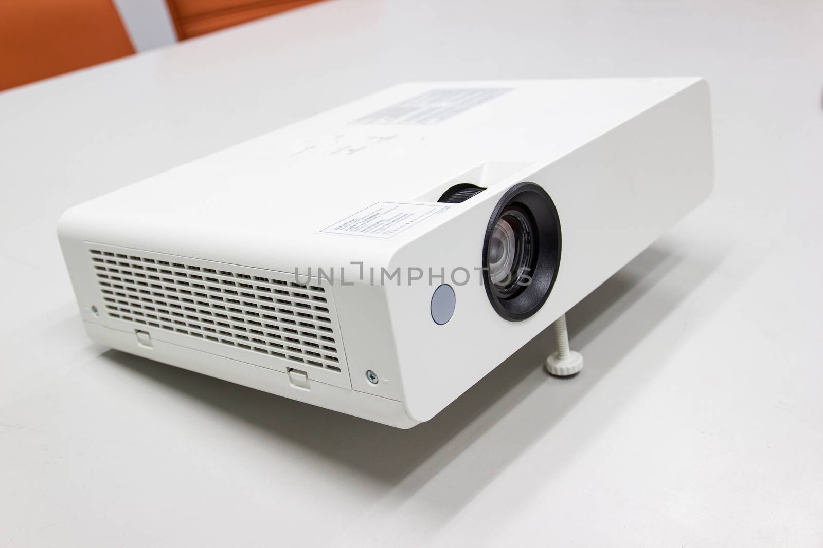 white projector for presentation for business work on table in a meeting room 