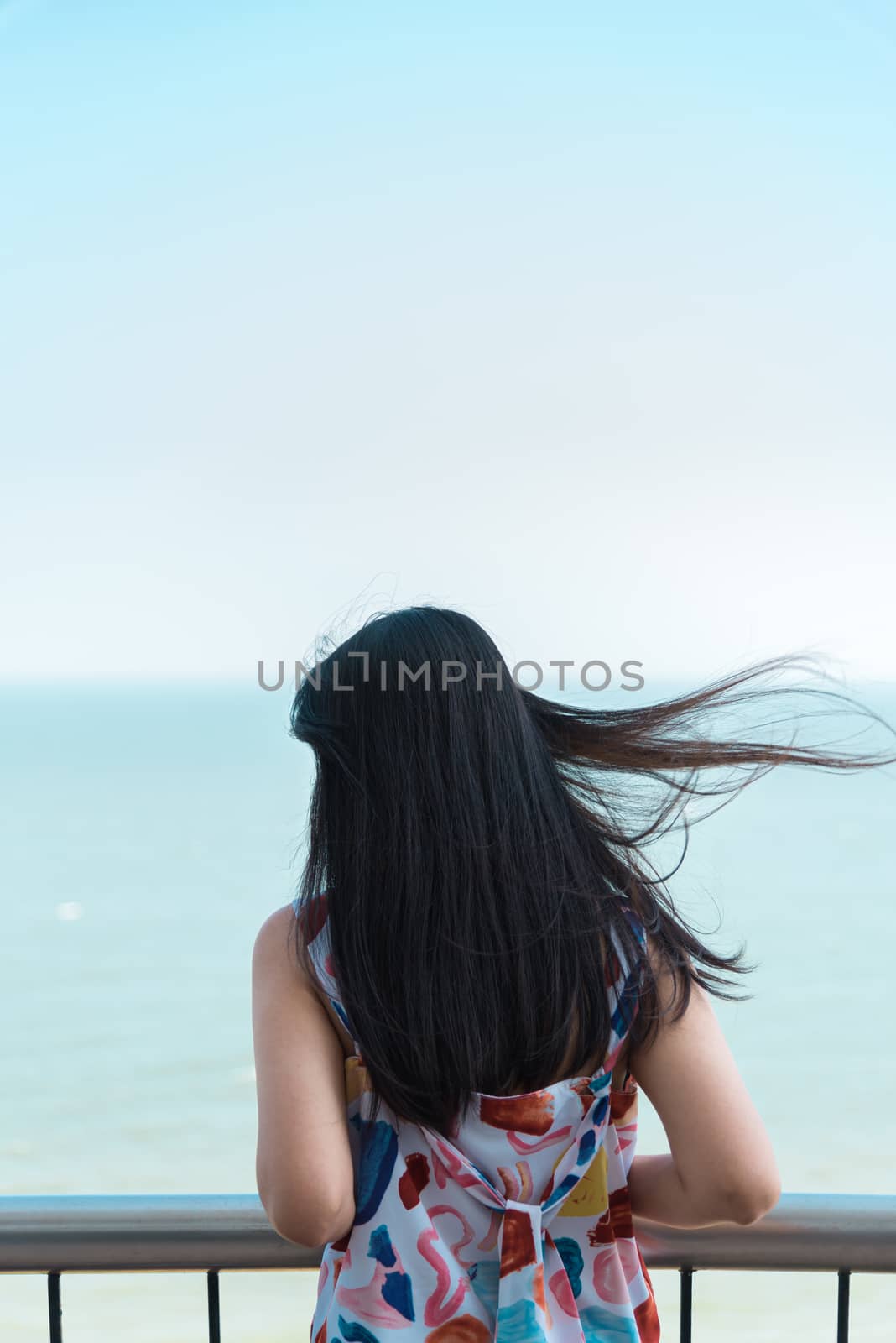 Asian pretty woman relax at sea viewpoint with loneliness and lonely emotion in concept travel, vacation, leisure in life