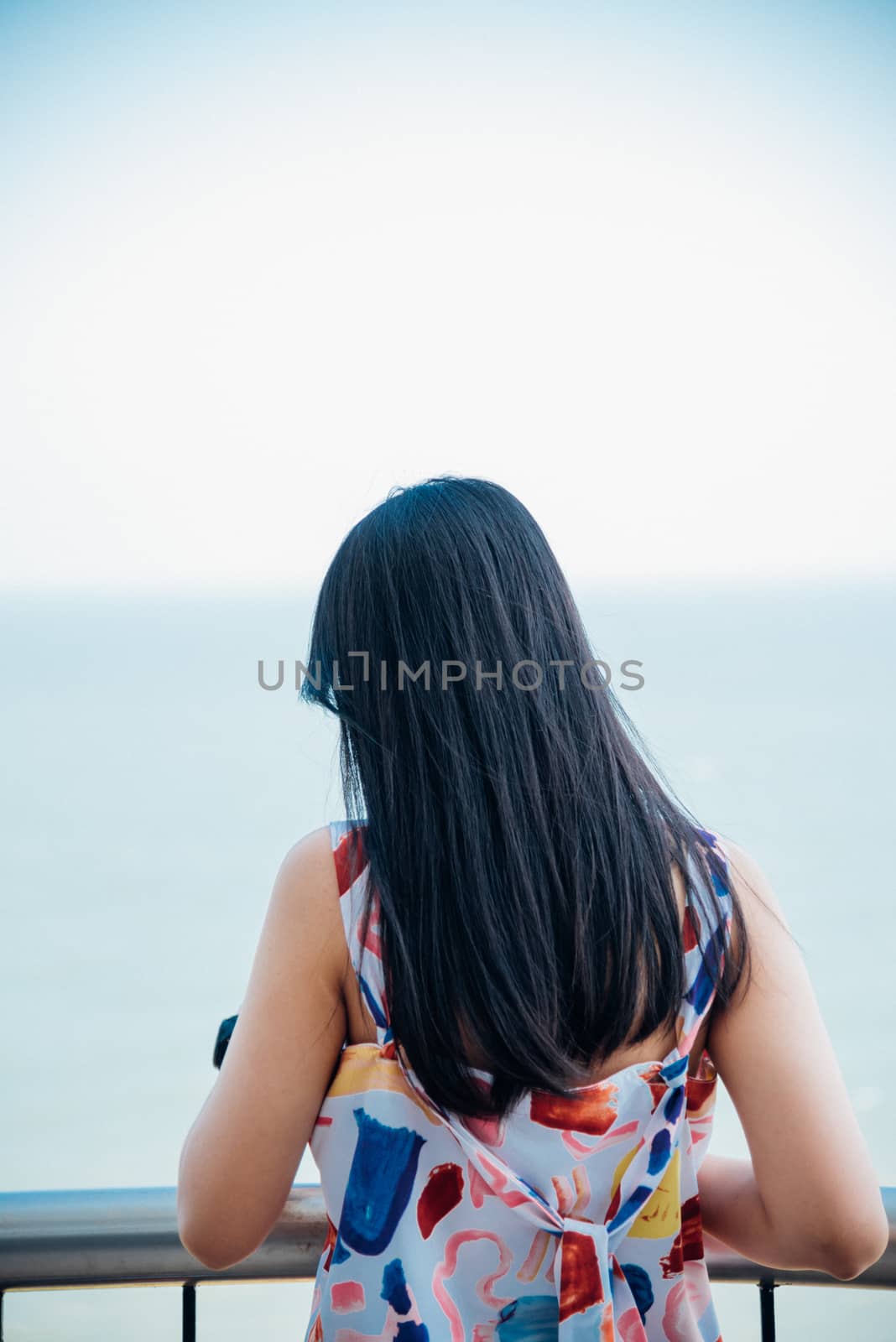 Asian pretty woman relax at sea viewpoint with loneliness and lonely emotion in concept travel, vacation, leisure in life