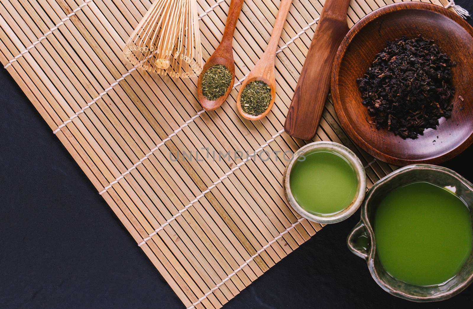 green tea matcha in a bowl on wooden surface by freedomnaruk