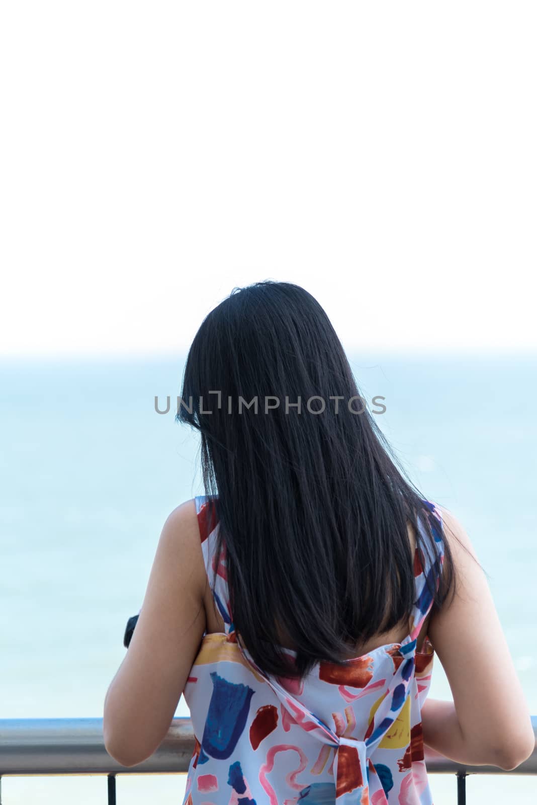 Asian pretty woman relax at sea viewpoint with loneliness and lonely emotion in concept travel, vacation, leisure in life