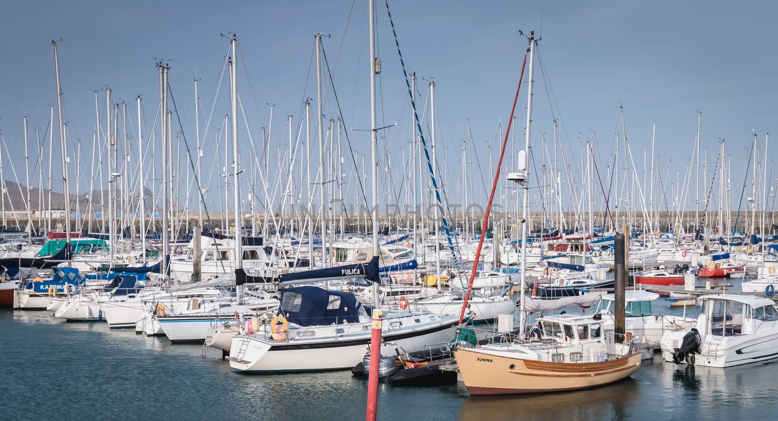 Howth near Dublin, Ireland - February 15, 2019: view of the marina of the city where are parked tourist boats on a winter day