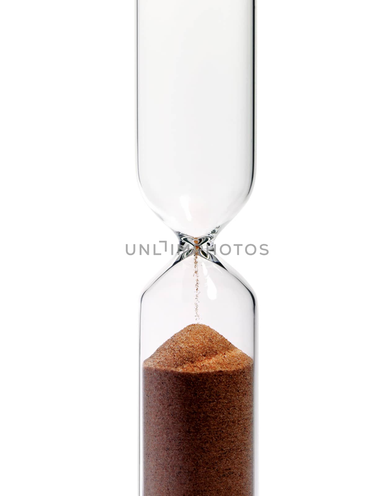 A vertical hourglass, isolated on white background, showing that the time has passed.