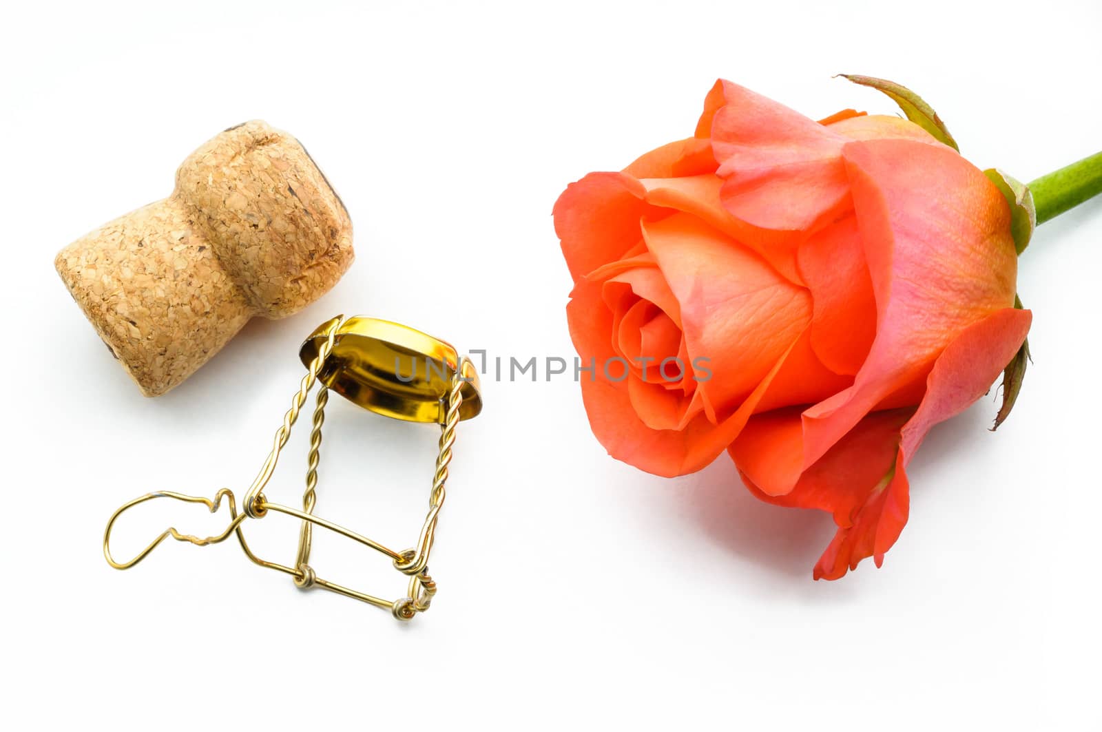 An orange rose and a Champagne's cork for Saint Valentine lovers' celebration