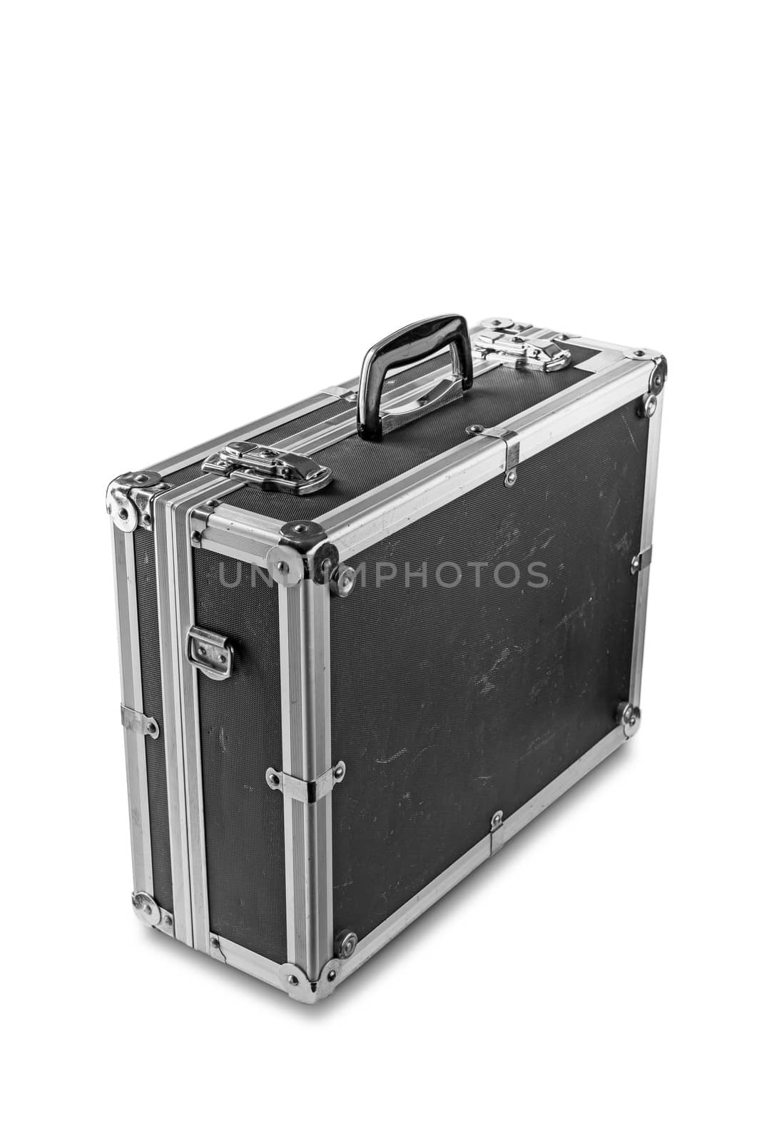 An old used aluminum photo flycase having travel several times around the world in many different countries