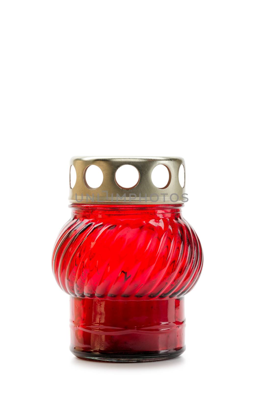 A red glass tea light with a candle inside to illuminate the Xmas evening and other celebrations