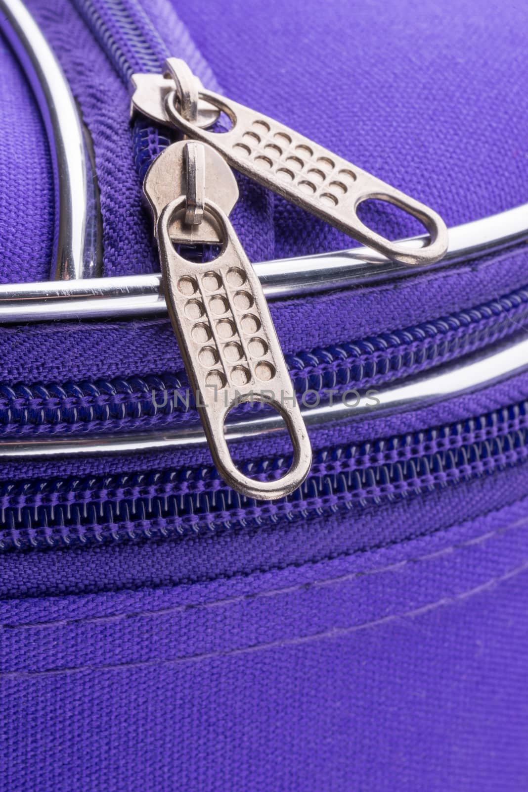 Pull Tab and Chain of a Zipper on a Violet Suitcase by MaxalTamor