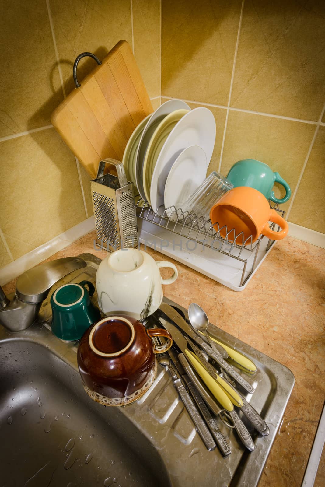 Dishes and Tableware Drying in Kitchen by MaxalTamor