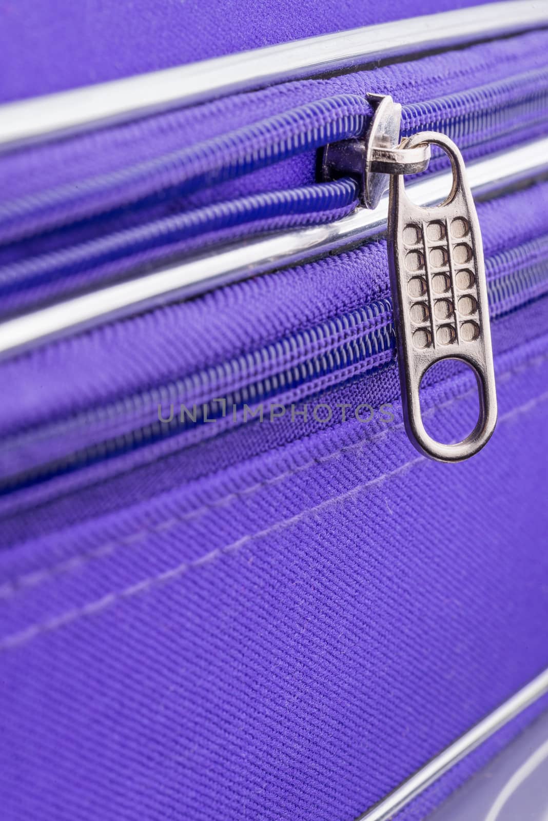 Pull Tab and Chain of a Zipper on a Violet Suitcase by MaxalTamor