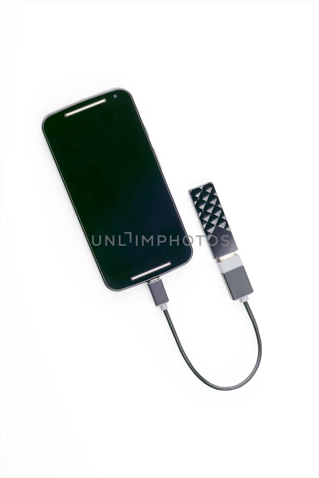 Black smartphone connected to a USB key with an OTG cable. Isolated on white background
