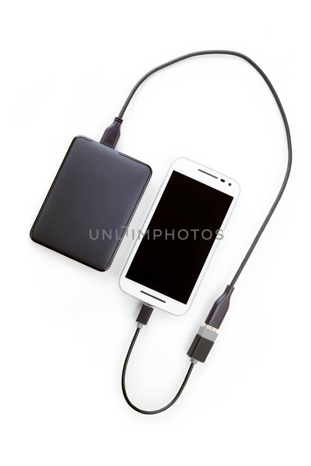 White smartphone connected to a black hard disk drive with an OTG cable. Isolated on white background