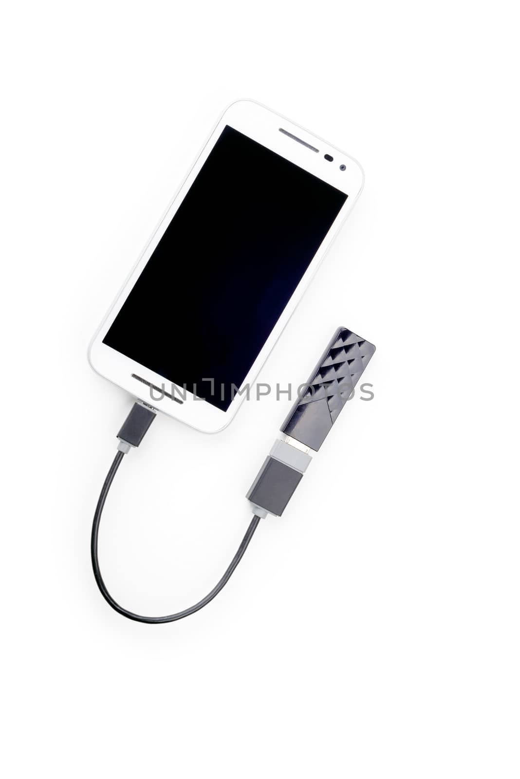 White smartphone connected to a black USB key with an OTG cable. Isolated on white background