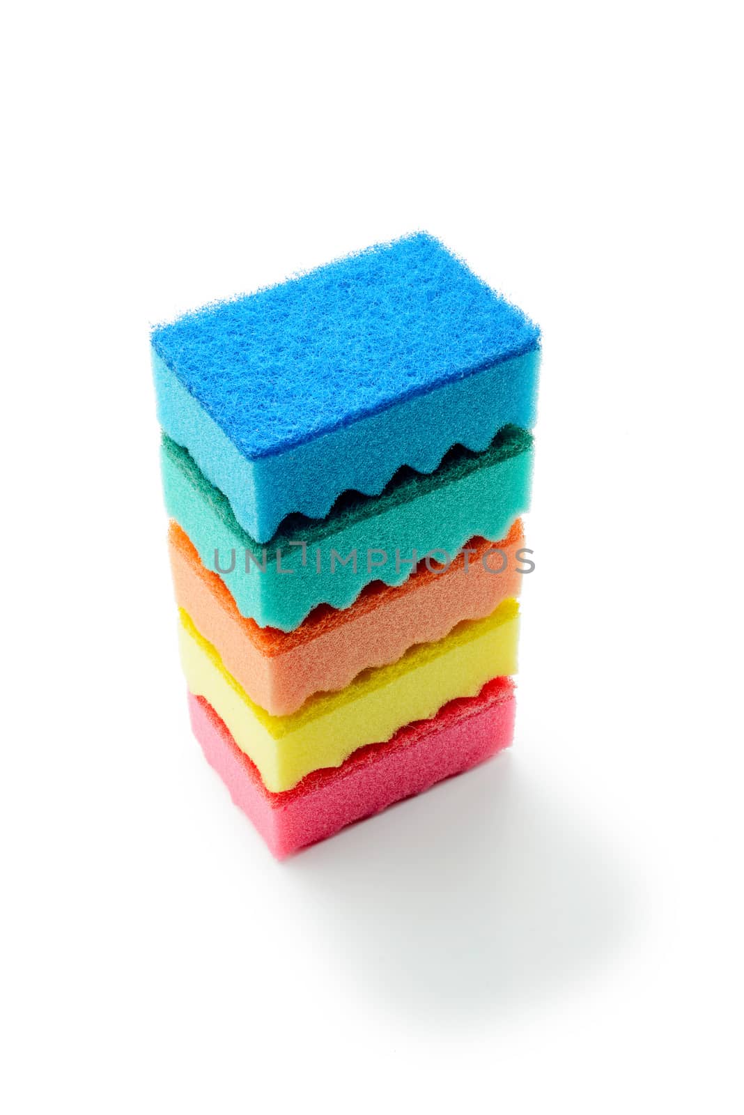A stack of multicolored kitchen sponges isolated on white background