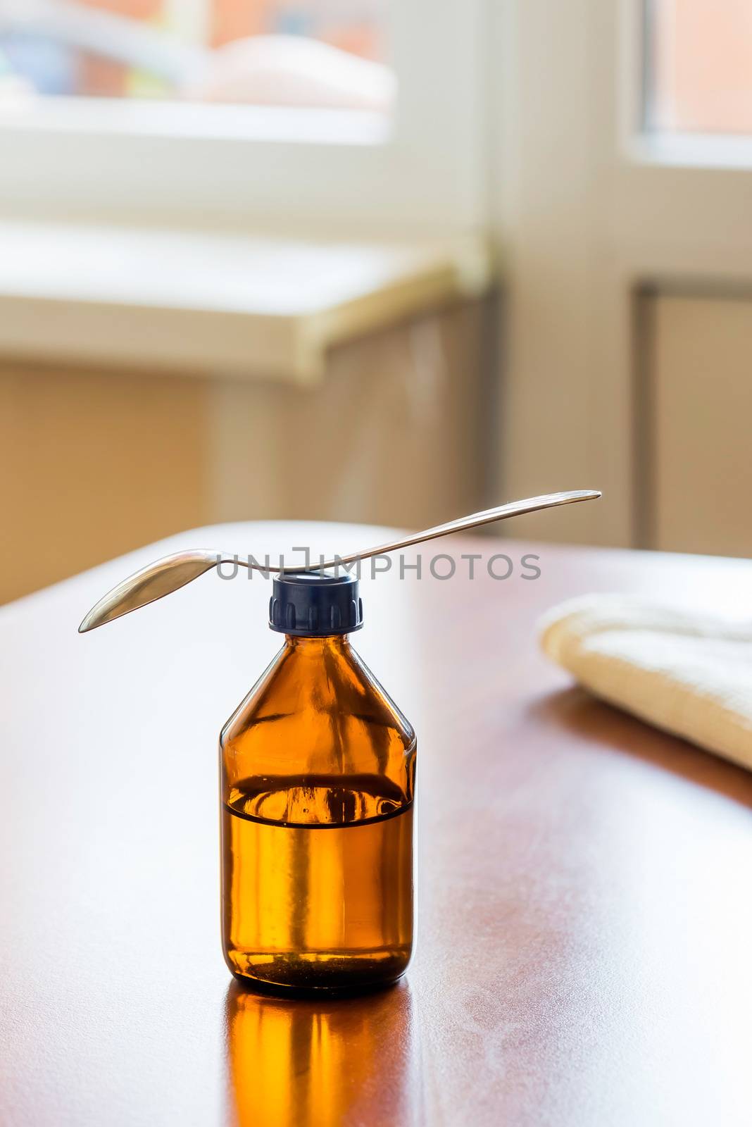 Cough Syrup Bottle With Spoon Close tothe Window by MaxalTamor