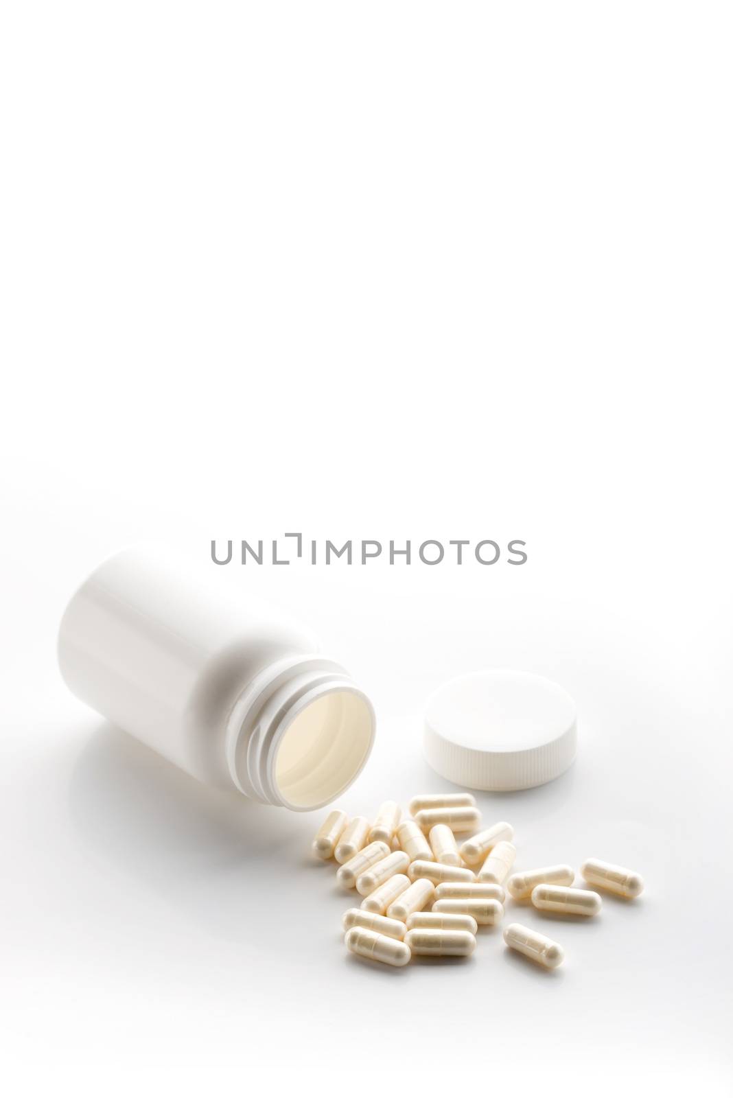 Yoghurt capsules isolated on a white background. Yoghurt Capsules aid in maintaining a normal healthy gastrointestinal system and digestive function.