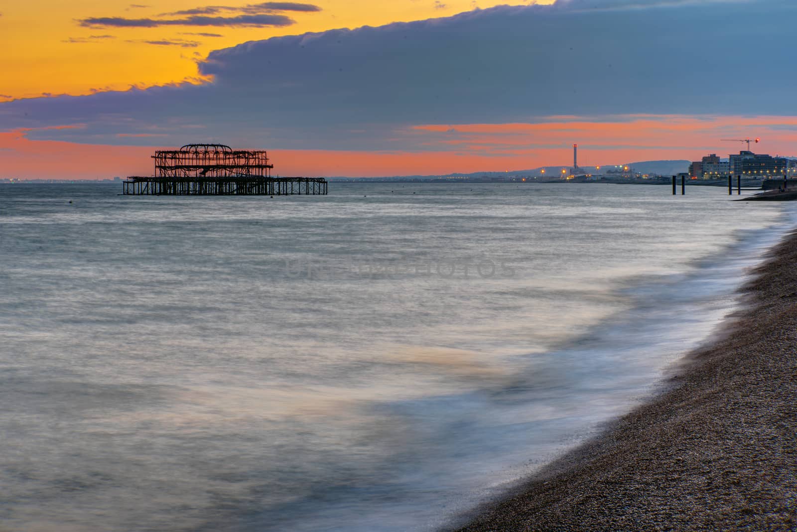 The beach in Brighton, England, after sunset by elxeneize