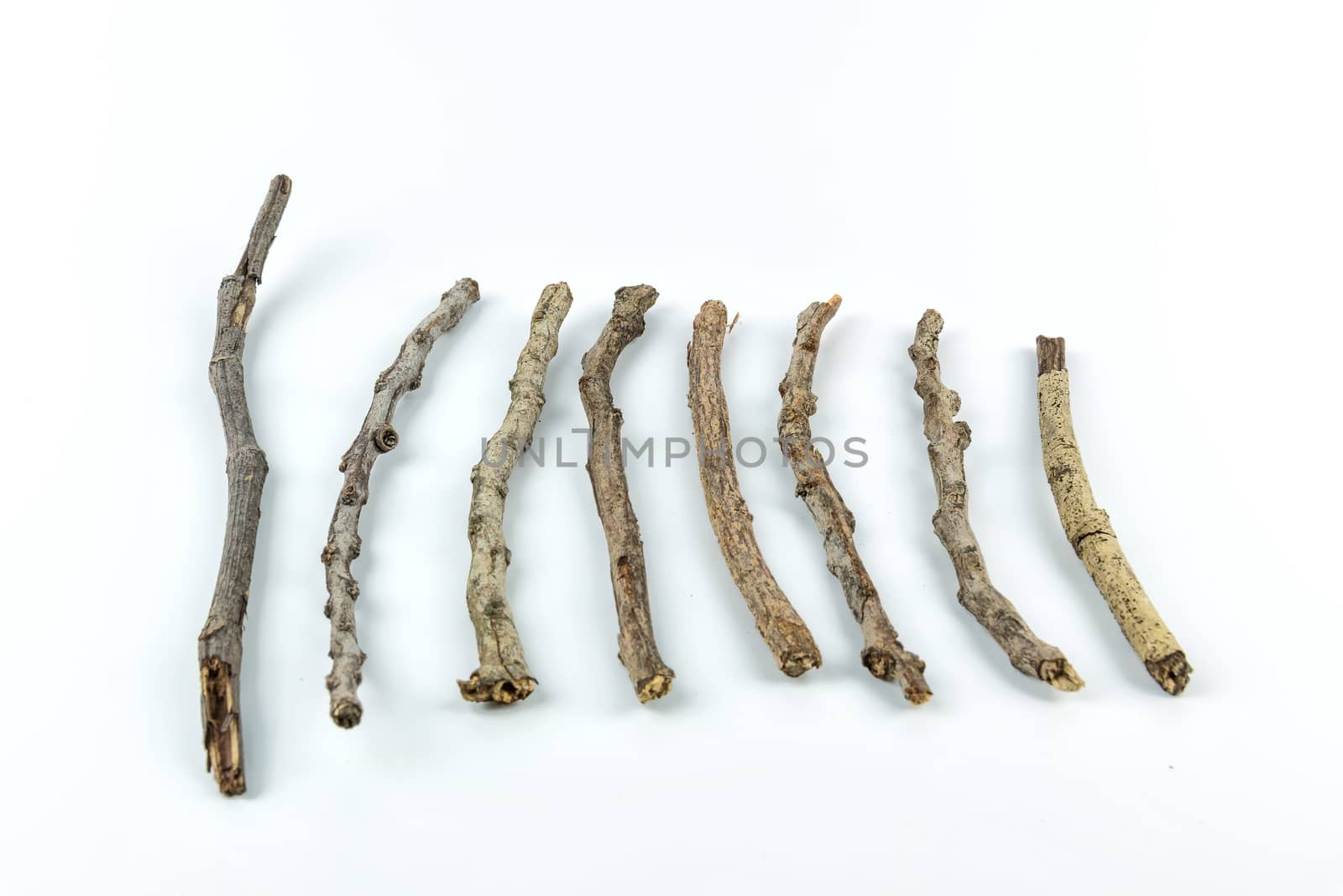 Pile of dry twigs on white background	