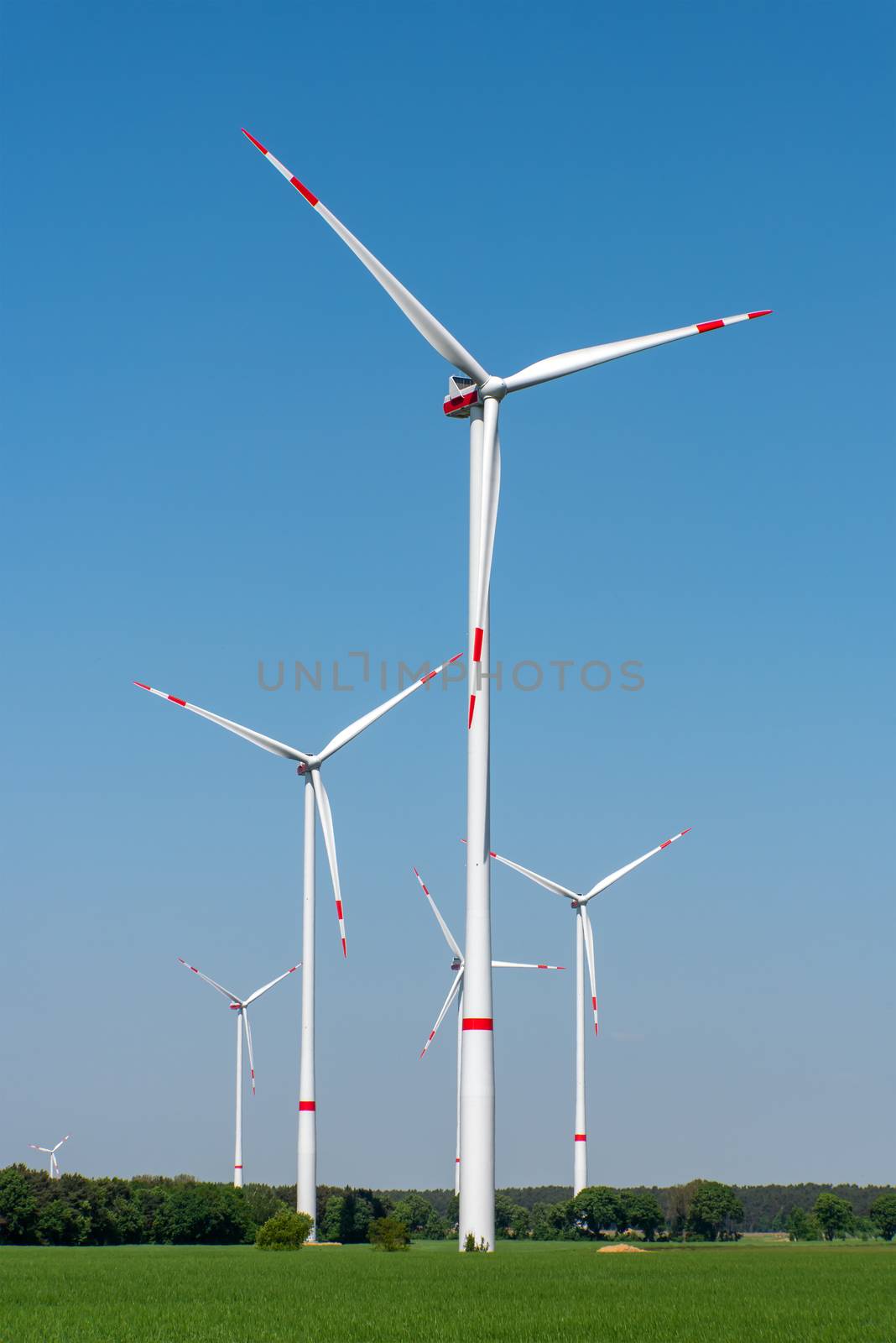 Wind turbines in a rural area by elxeneize