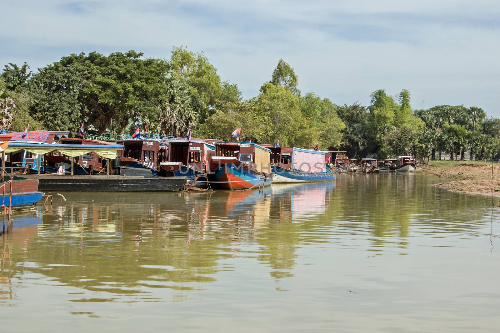 Kompong Phluk,  Cambodia - December 4, 2011:  Pleasure boats moored on the shores of the Tonle Sap lake at Kompong Phluk near Siem Reap.