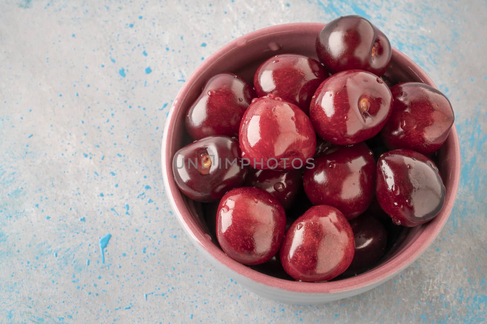 closeup fresh ripe cherry fruits in a bowl by bernanamoglu