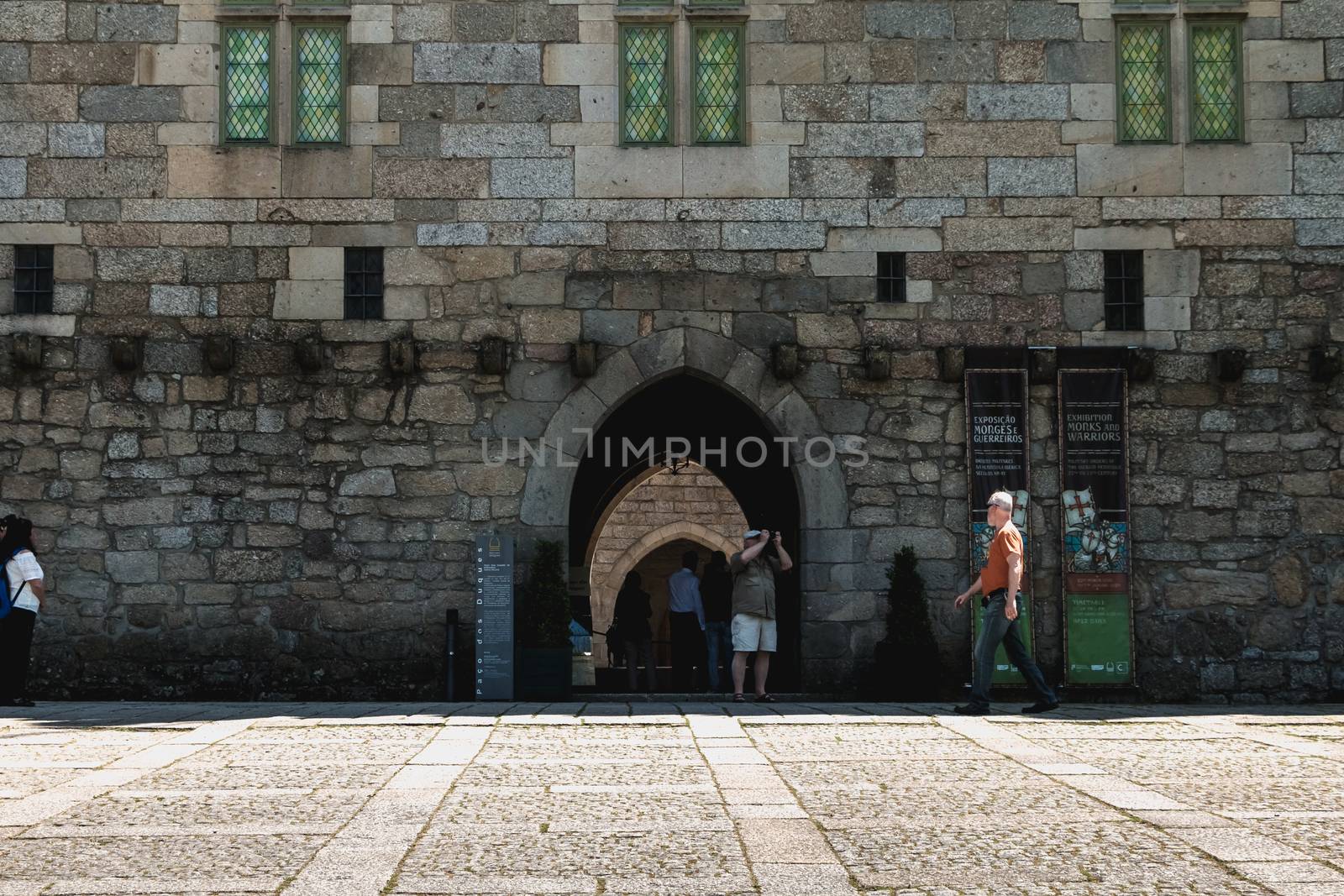 Guimaraes, Portugal - May 10, 2018: architectural detail of the Palace of the Dukes of Braganza next to the castle of Guimaraes that tourists visit on a spring day.