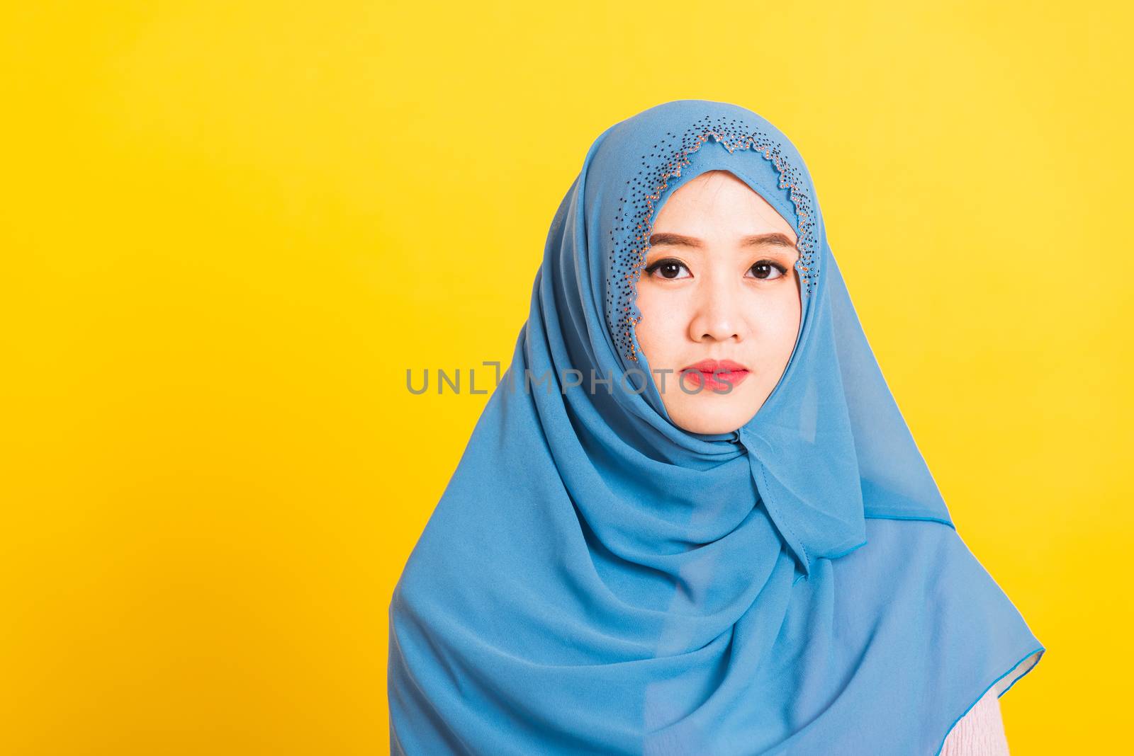 Asian Muslim Arab, Portrait of happy beautiful young woman religious wear veil hijab smiling studio shot isolated, yellow background with copy space, Close up skin face