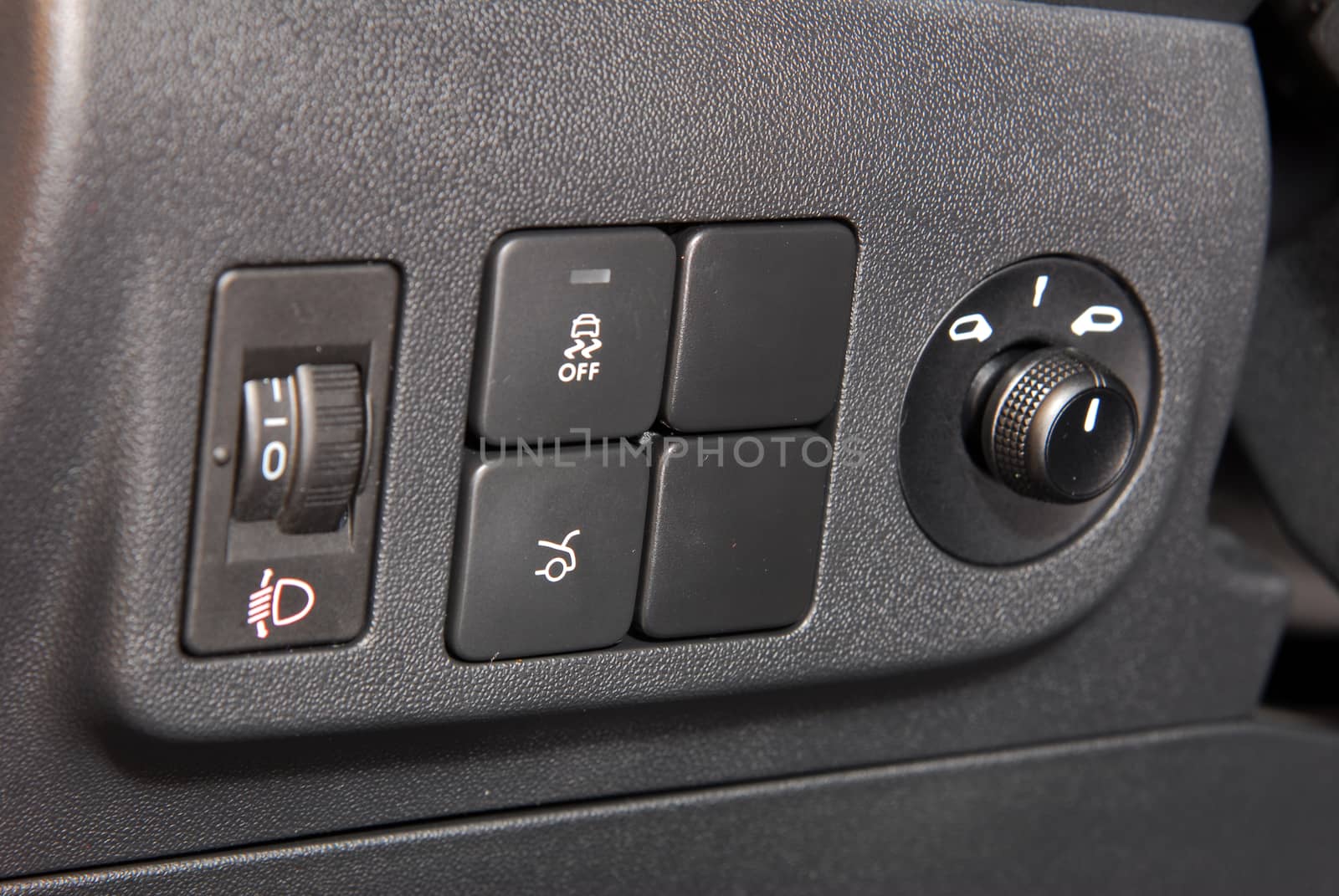 Close-up of black buttons on car panel
