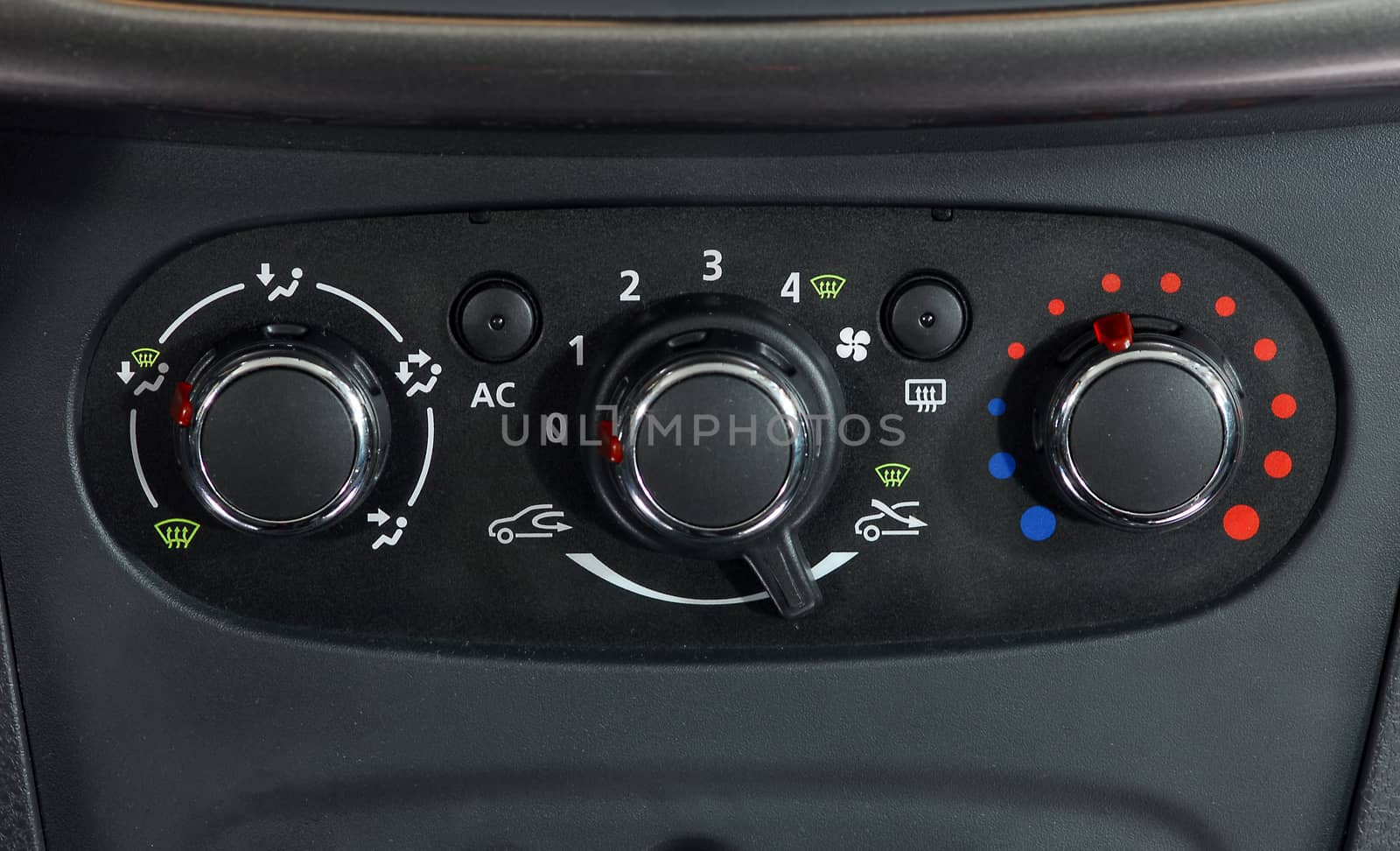manual switches the air conditioning on the dashboard of the car