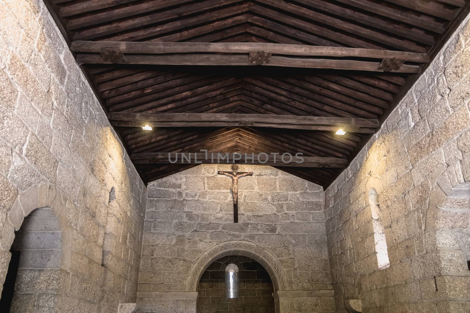 Guimaraes, Portugal - May 10, 2018: architectural detail of the Chapel of St. Michael next to the castle of Guimaraes that tourists visit on a spring day.