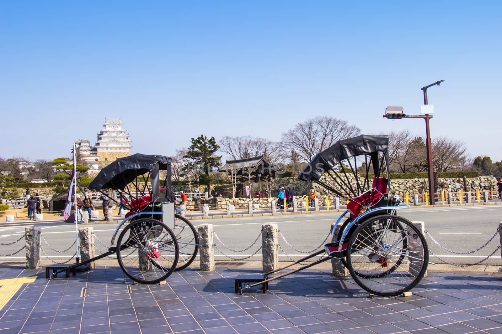 Rickshaw waiting for tourist service around himeji castle on day blue sky bright hyogo prefecture. Japan
