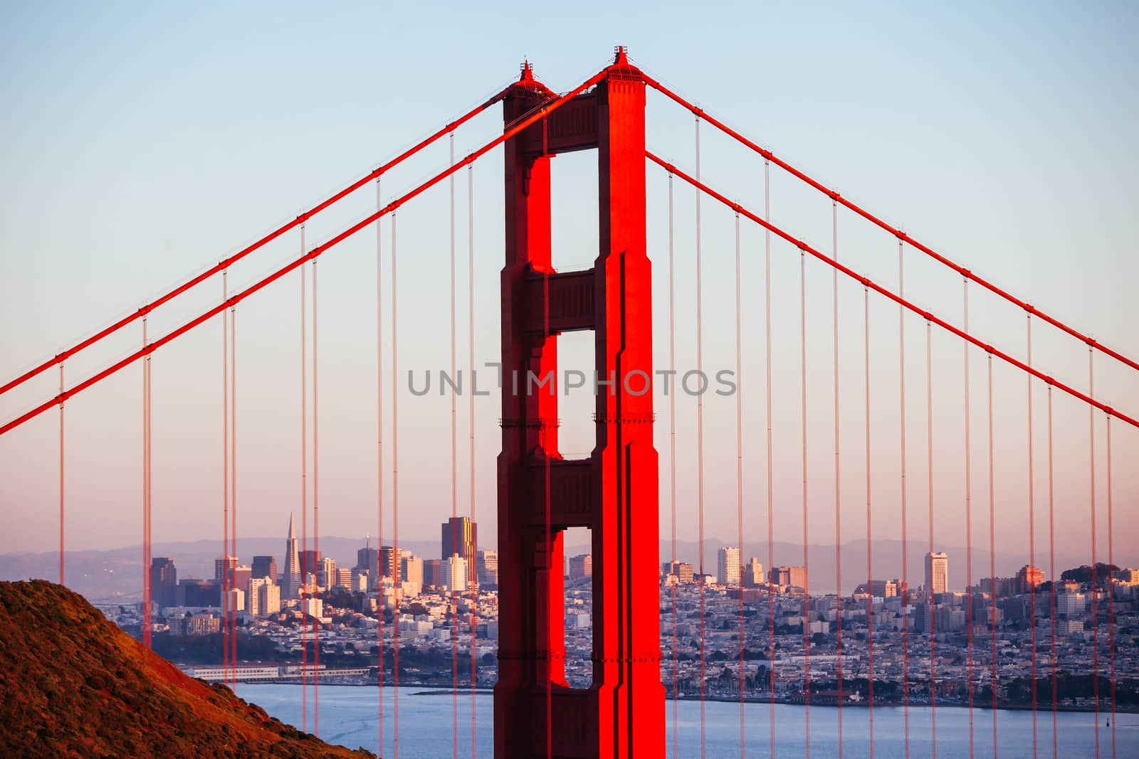 A view at dusk thru the Golden Gate Bridge towards downtown San Francisco. In California, USA.