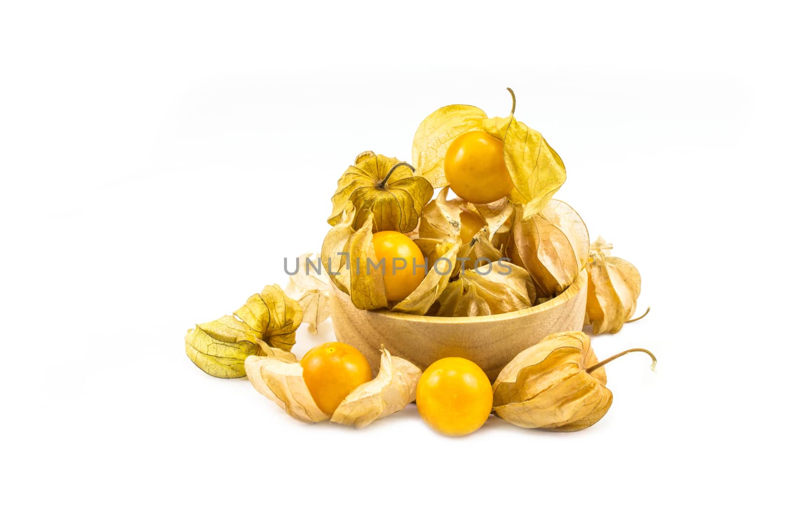 Cape gooseberry put in wood bowl physalis isolated on white background.