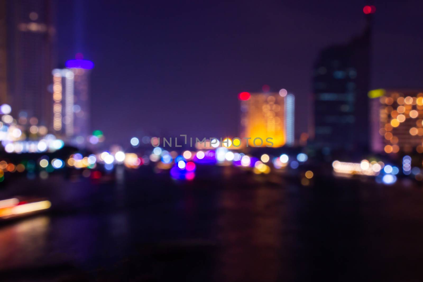 Night twilight blurred light bokeh in downtown bangkok abstract background. by prapstock