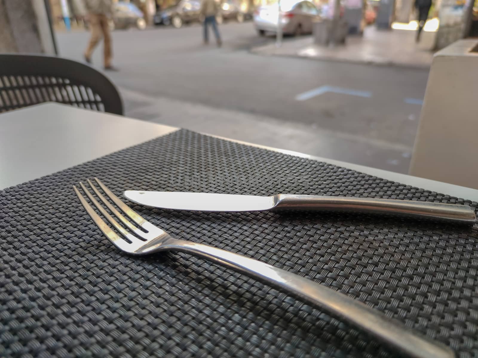 a fork and a knife in a restaurant table by devoxer