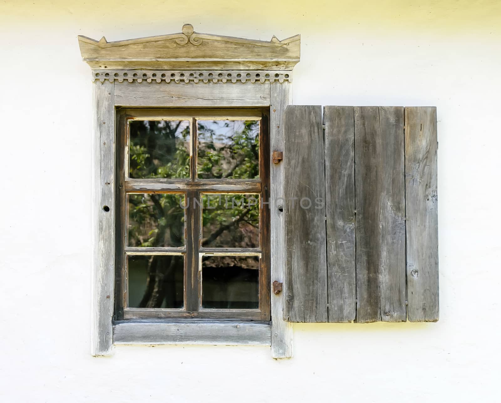 Detail of a window of a typical ukrainian antique house, in Pirogovo near Kiev