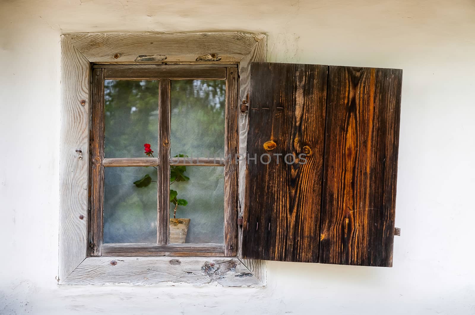 Detail of a window of a typical ukrainian antique house, in Pirogovo near Kiev