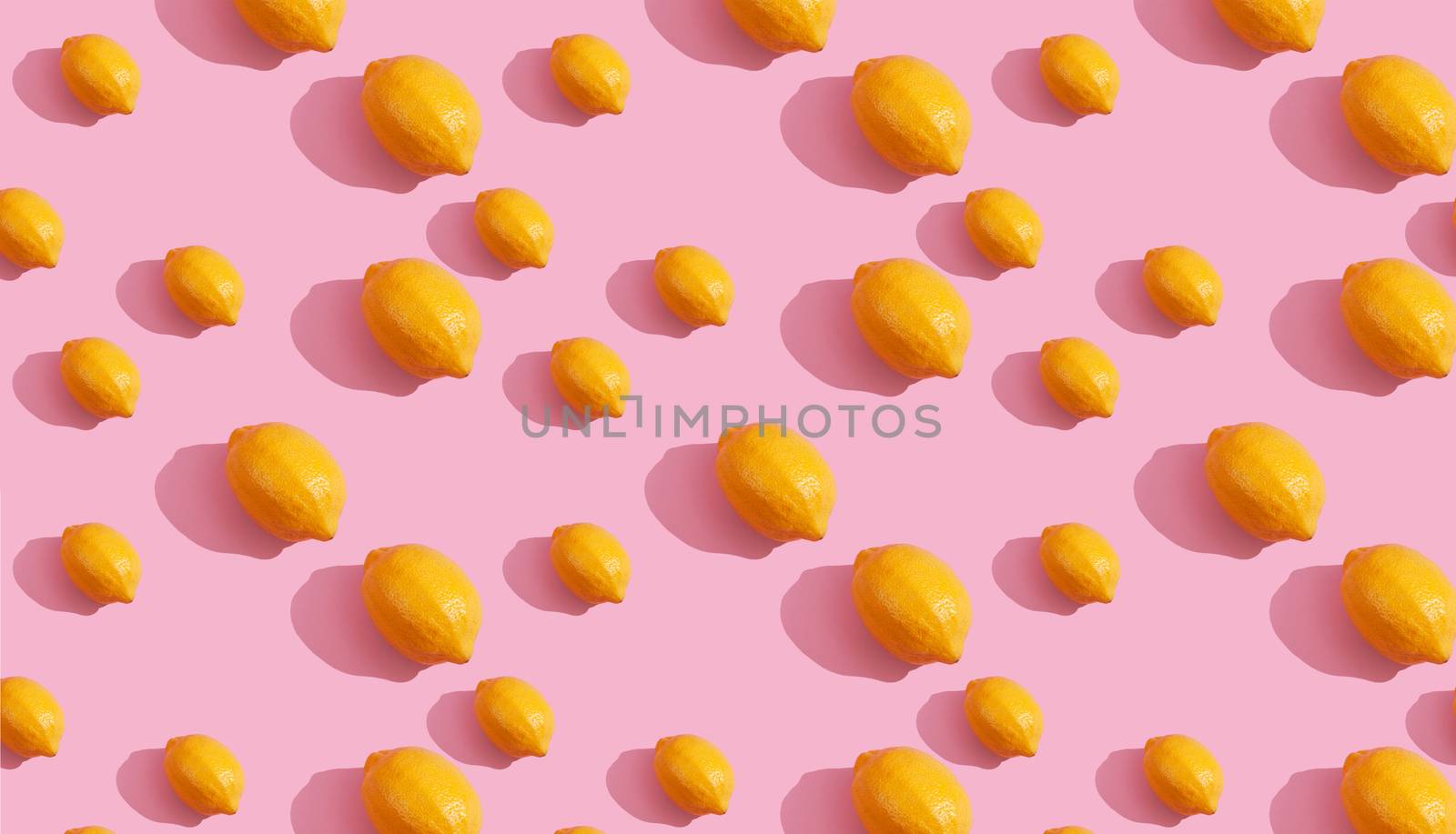 Seamless continuous pattern of yellow lemons on pink background. Minimalist concept of fresh citrus fruit by polyats