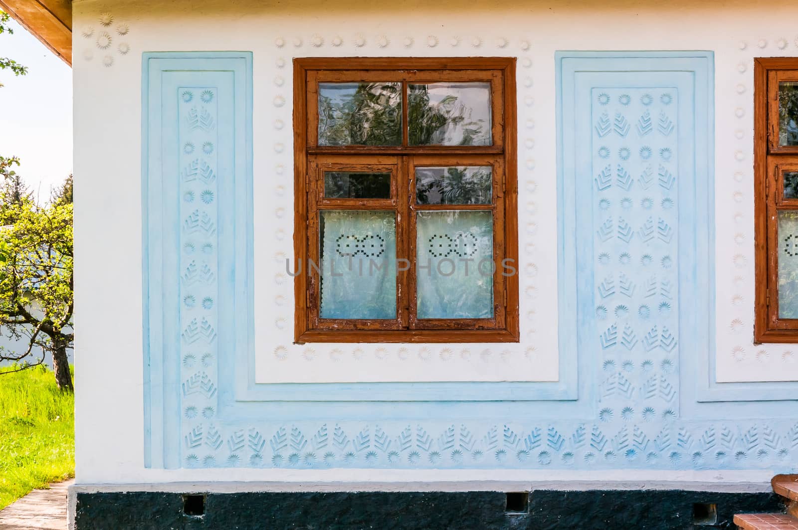 Detail of a window of a typical ukrainian antique house, in Pirogovo near Kiev