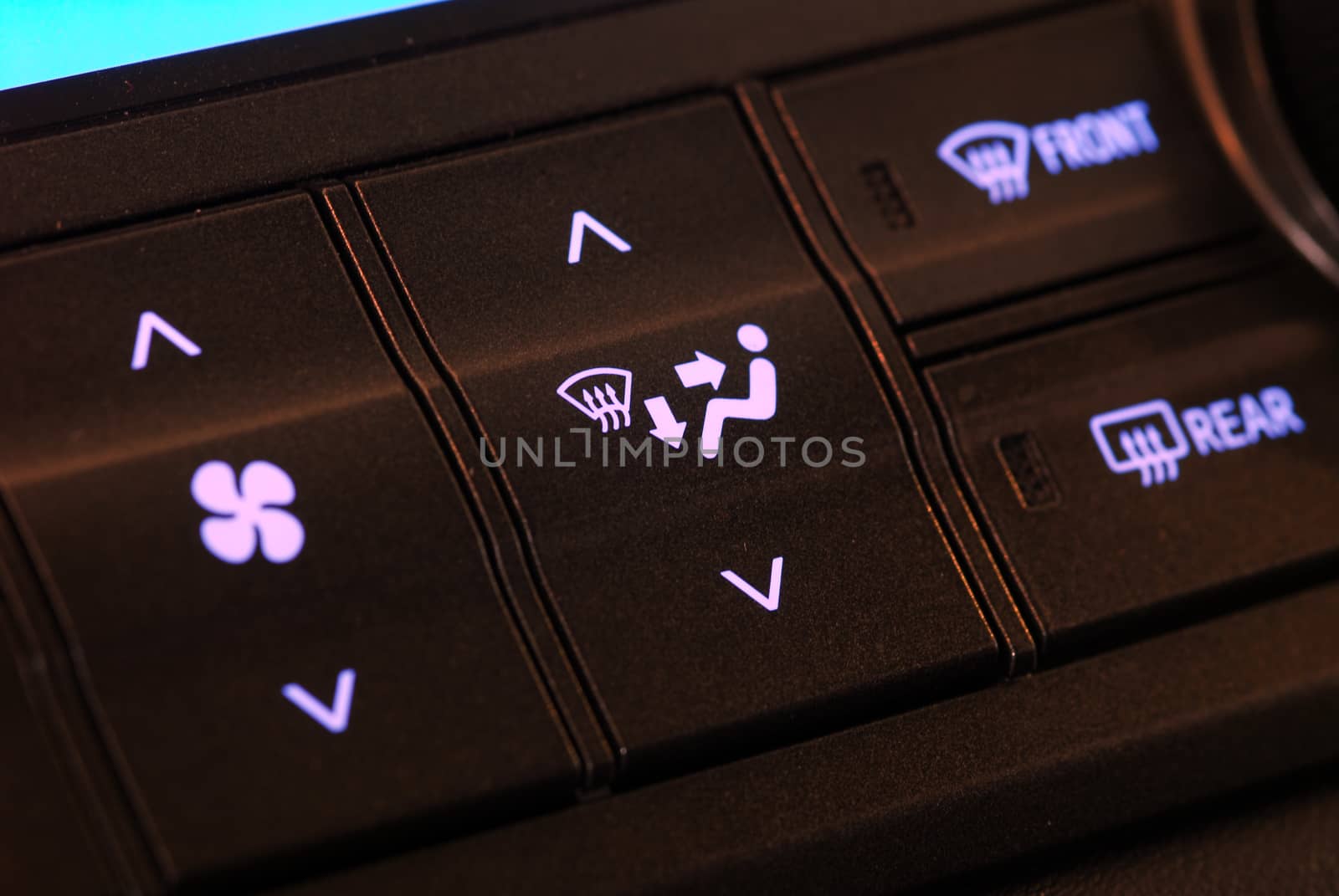 a group of buttons and switches on the dashboard of cars