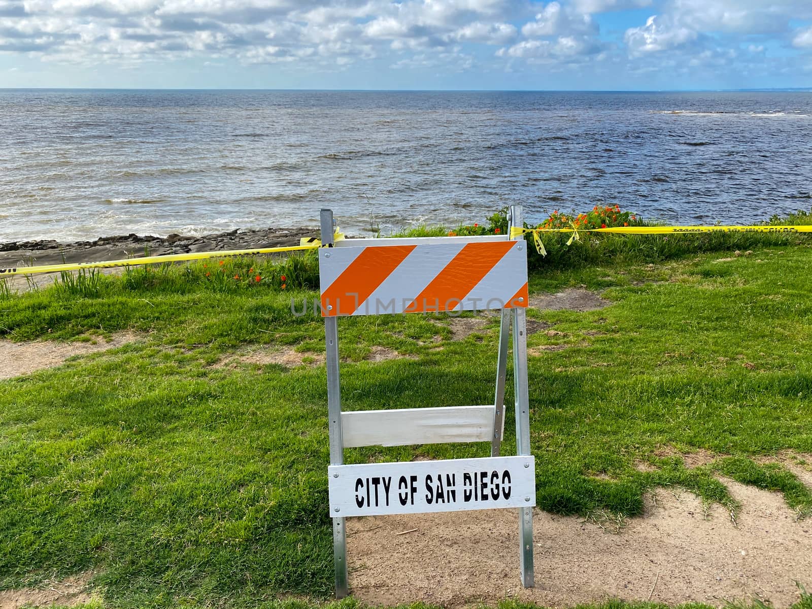 CClosed beach of La Jolla with informative signage during COVID-19 pandemic. Coronavirus virus panic and quarantine San Diego, USA, April 18th, 2020