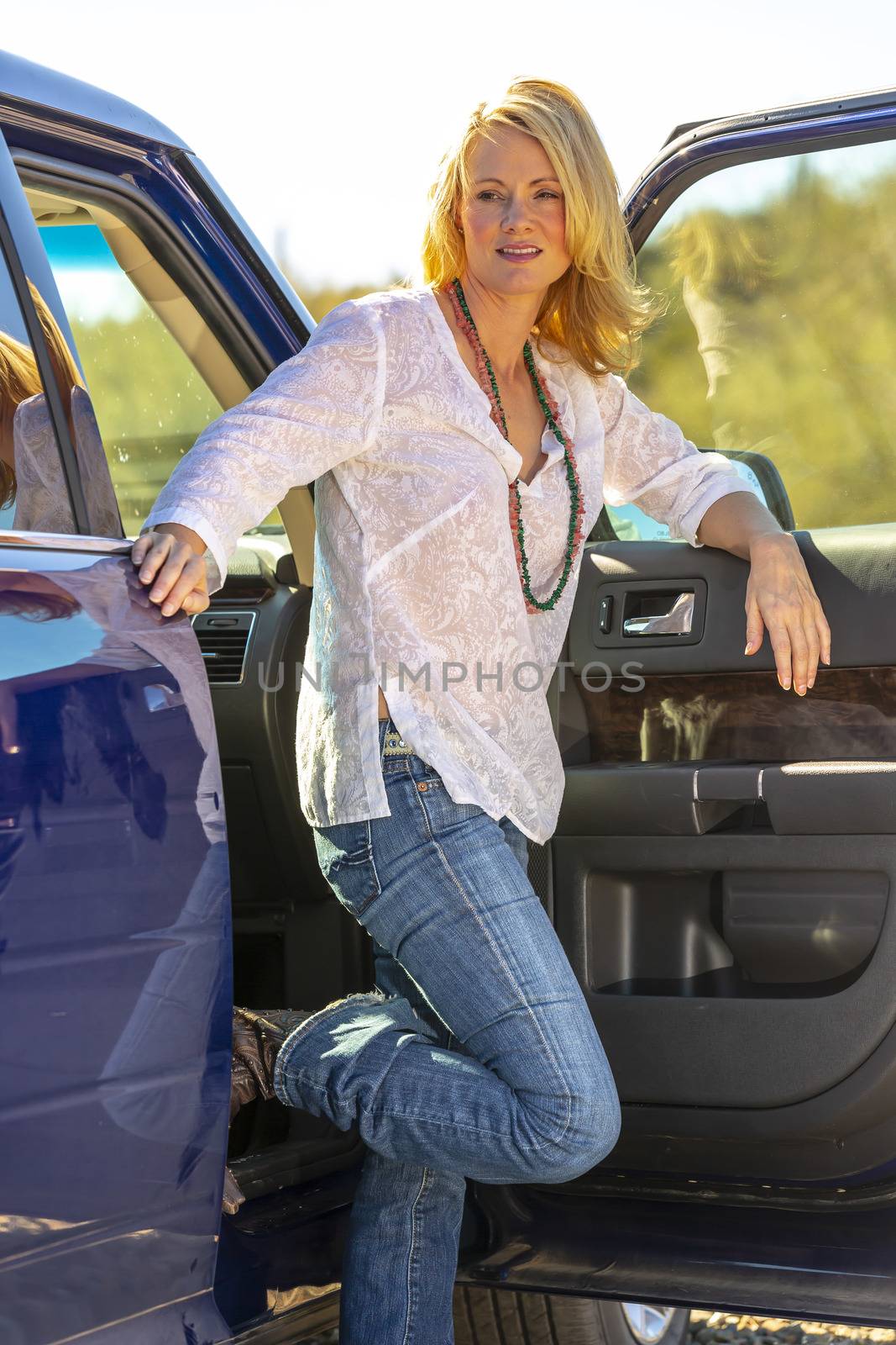 A gorgeous blonde model enjoys a spring day outdoors in the American Southwest