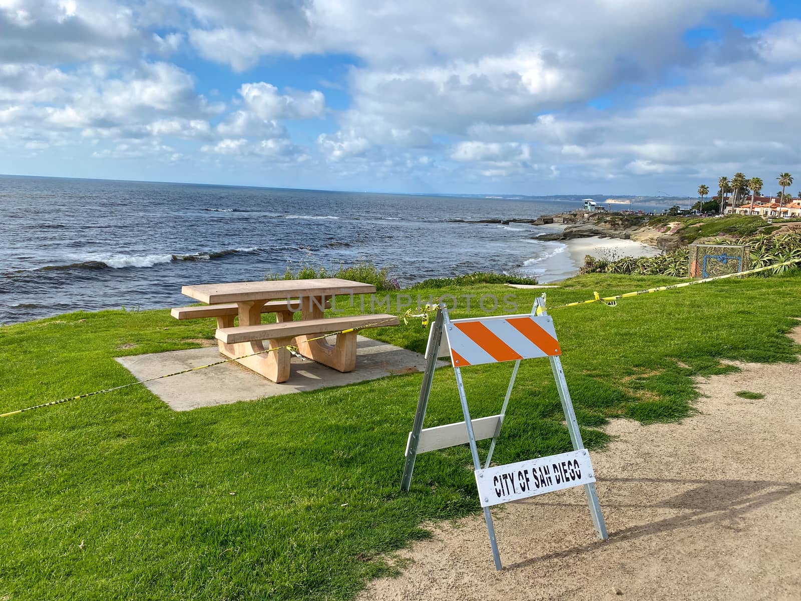 CClosed beach of La Jolla with informative signage during COVID-19 pandemic. Coronavirus virus panic and quarantine San Diego, USA, April 18th, 2020