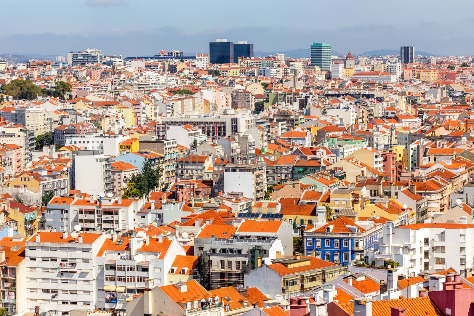 View to downtown of Lisbon with miltiple streets and houses and business buildings in a background, Portugal