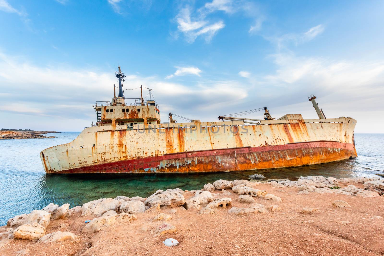 Abandoned rusty ship stranded ashore nearby Peyia village, Papho by ambeon