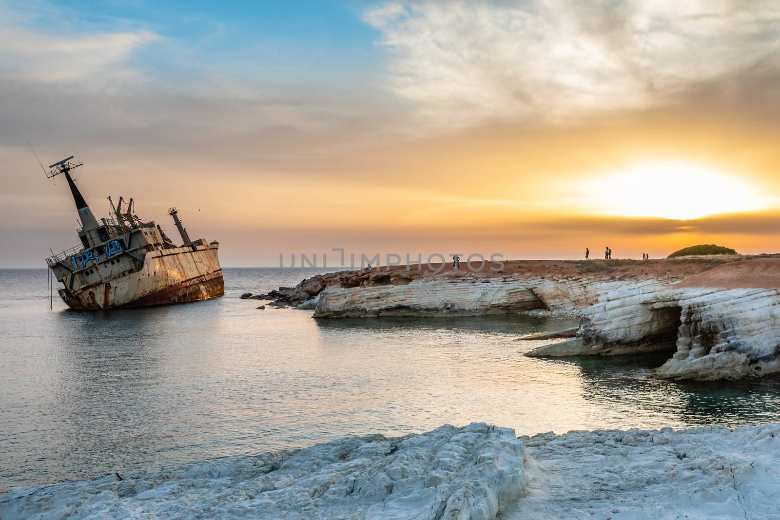 Abandoned rusty ship stranded ashore  in the sunset rays at Peyi by ambeon