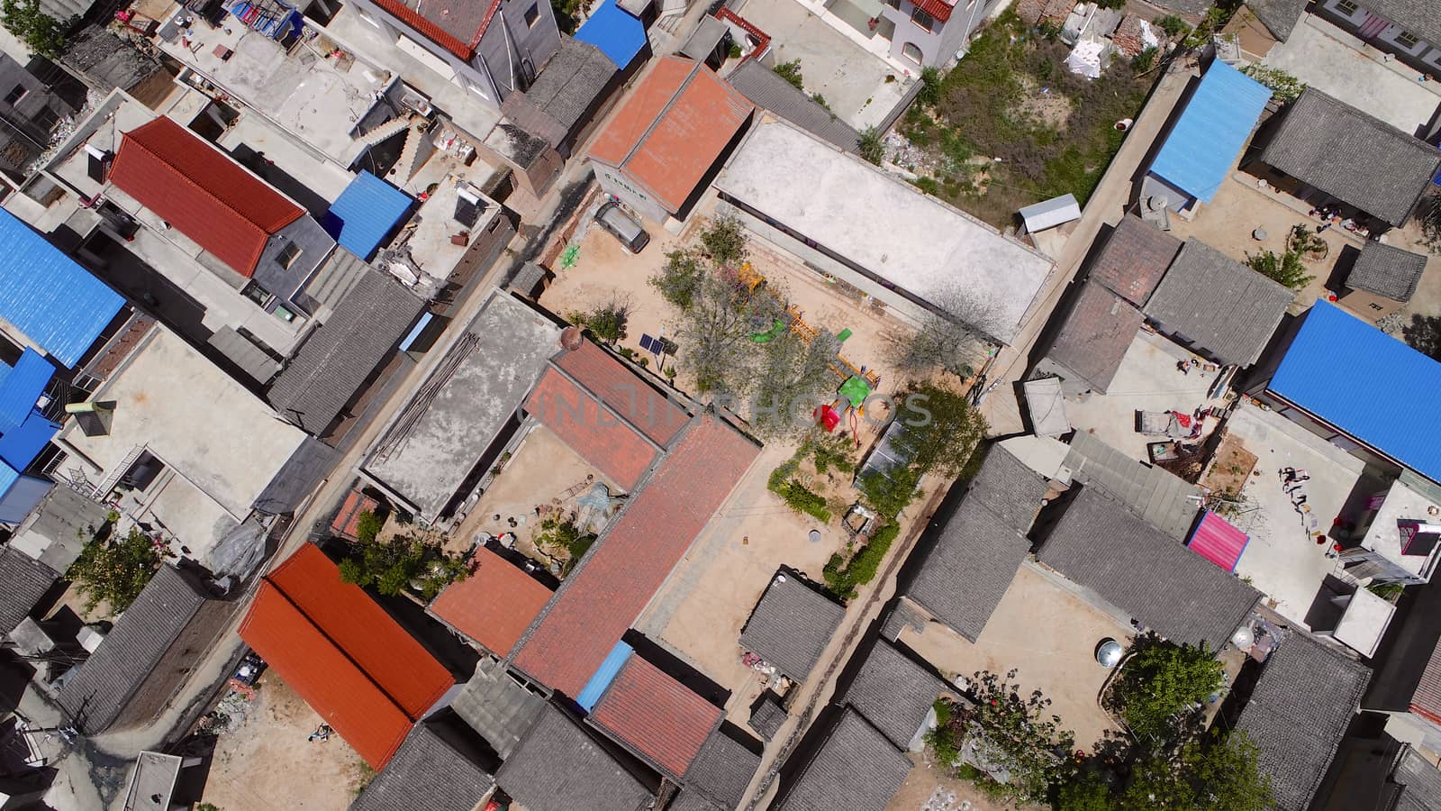 Aerial top view of small poor town houses in Gansu region, China