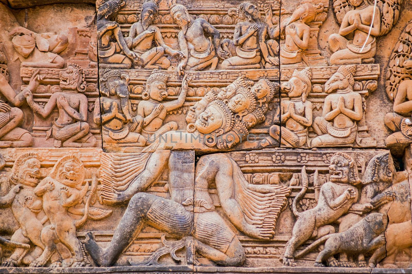 Ancient Khmer bas relief carving of Ravana the Hindu demon with one thousand heads and one thousand arms. Tympanum of the south library at Banteay Srei Temple, Angkor, Cambodia.