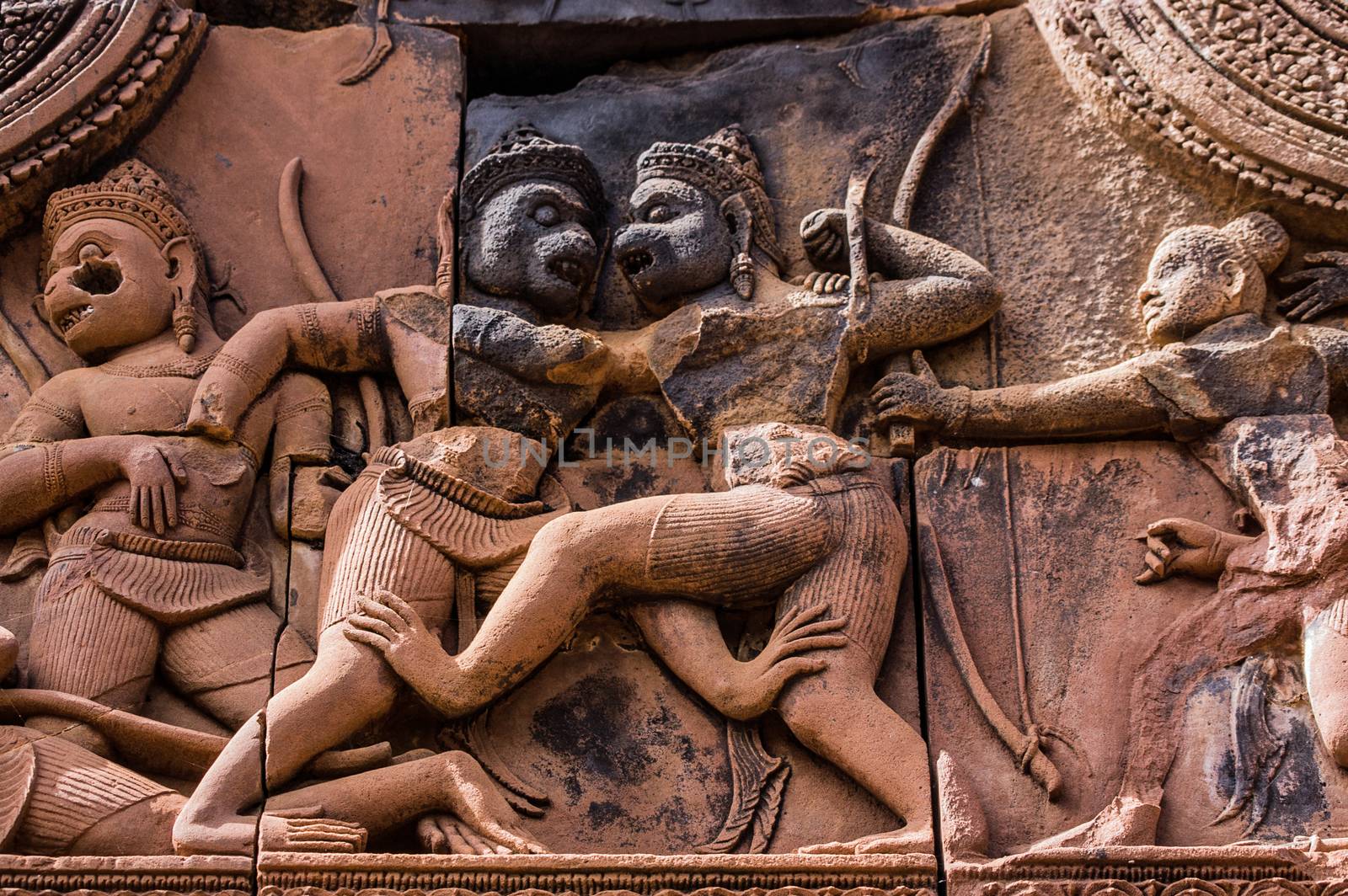 Ancient Khmer carving of the combat between Sugriva and Valin. The Hindu epic, Ramayana describes how Sugriva defeated his brother to rule the monkey kingdom. Banteay Srei Temple, Angkor, Cambodia.