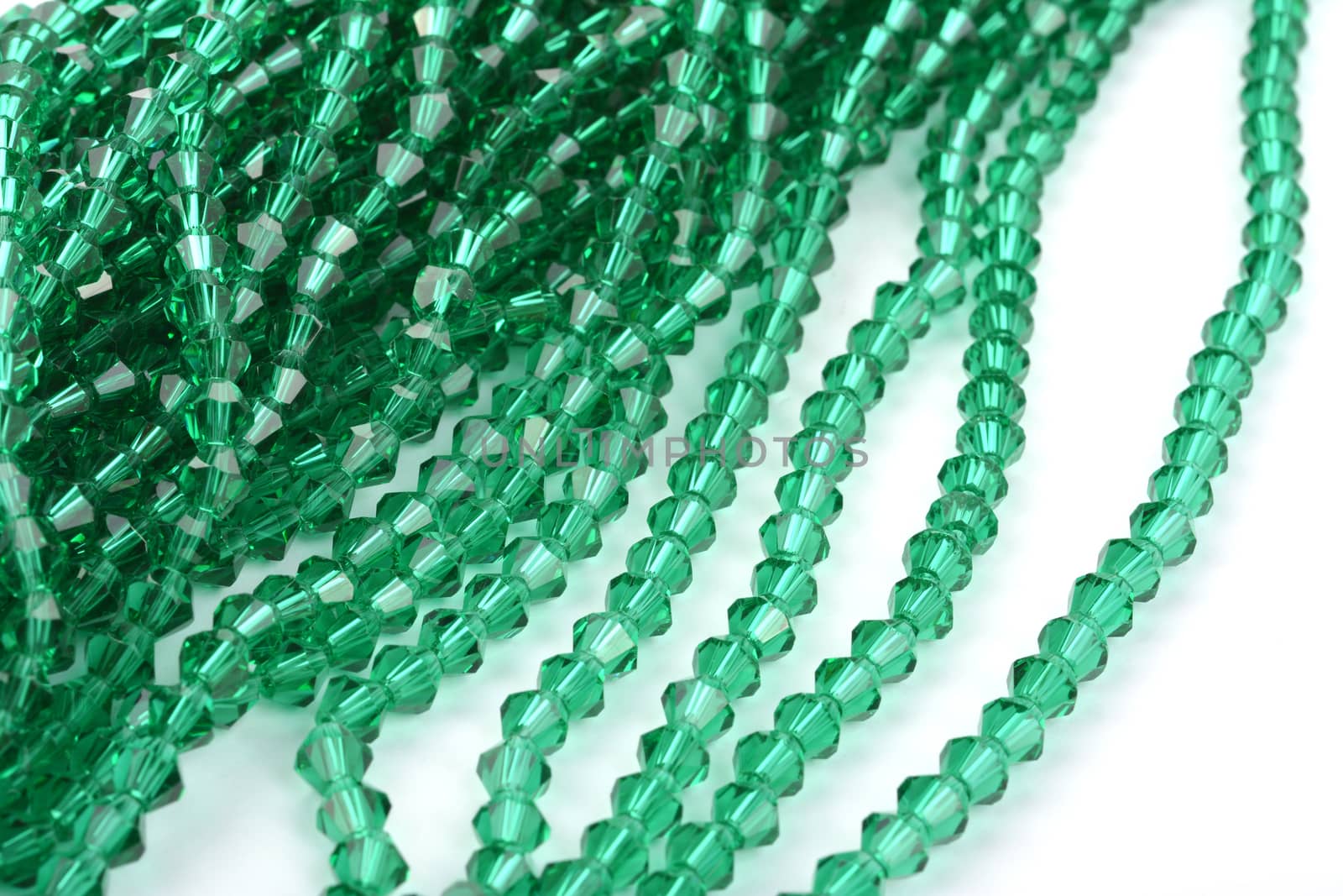 green Glass Sparkle Crystal Isoalted Beads on white background. Use for diy beaded jewelry by polyats