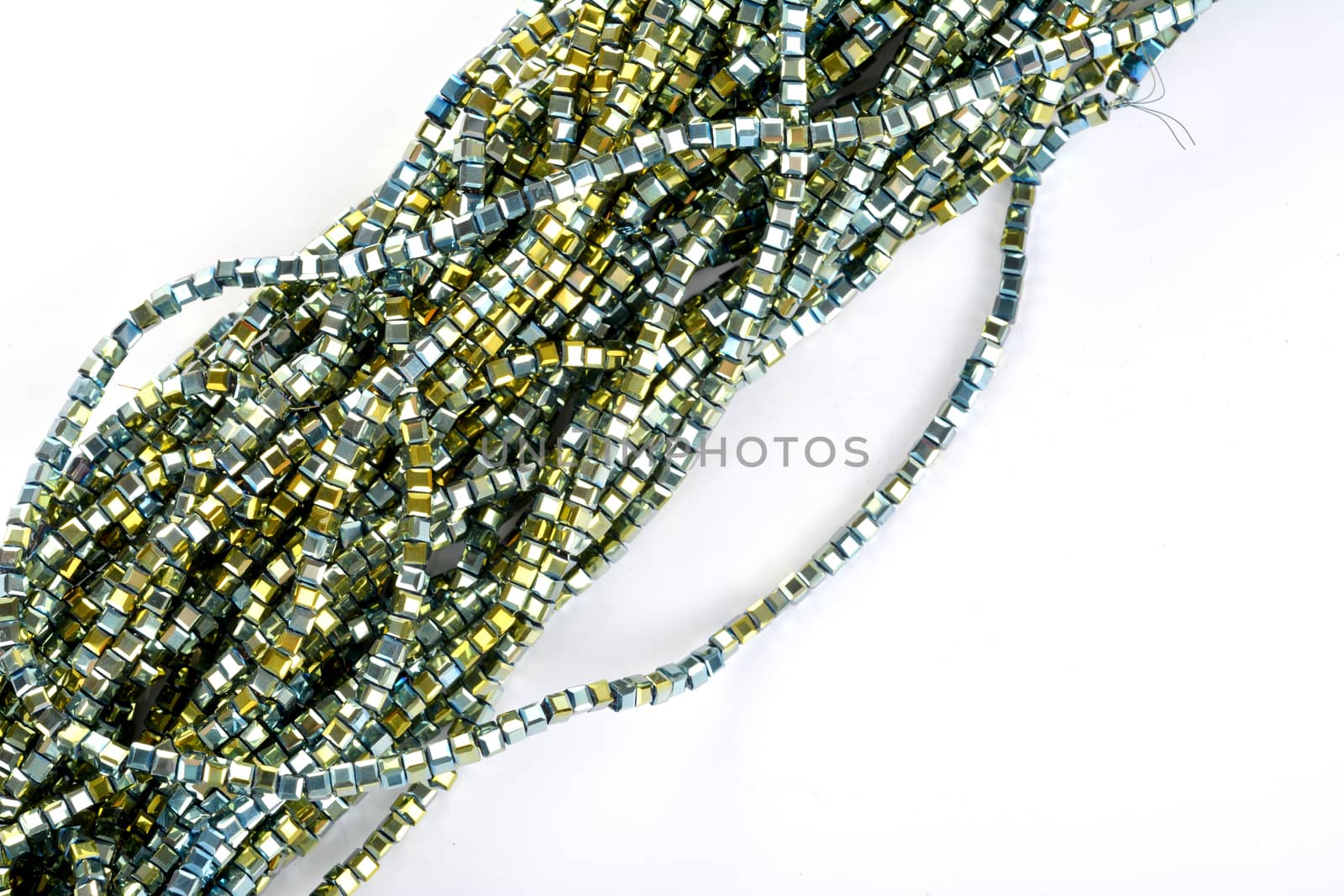 green Glass Sparkle Crystal Isoalted Beads on white background. Use for diy beaded jewelry by polyats